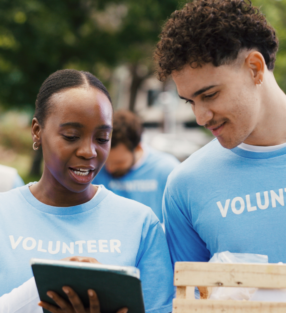 volunteer looking at an ipad outdoors